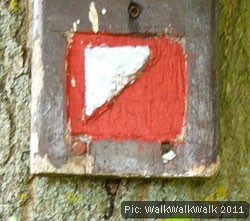 Orienteering symbol on a wooden plaque