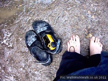 Bare feet, sandals and a GPS receiver